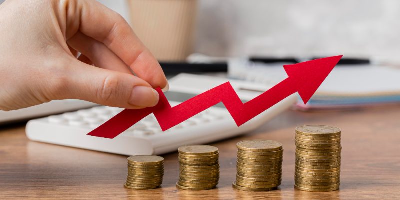 hand-holding-growth-arrow-with-coins
